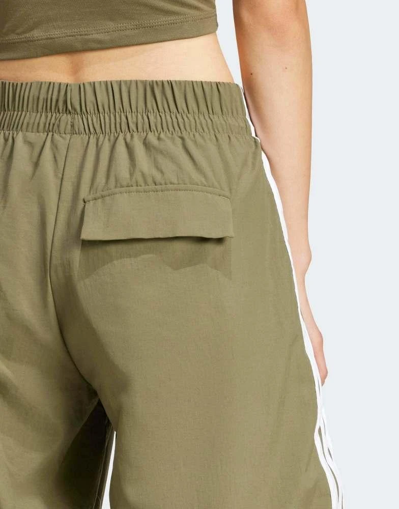 Adidas adidas Performance essentials 3-stripes lifestyle woven parachute pants in green 3