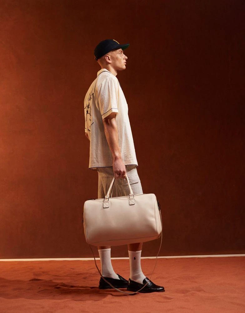 ASOS ASOS DESIGN faux leather holdall in ecru 1