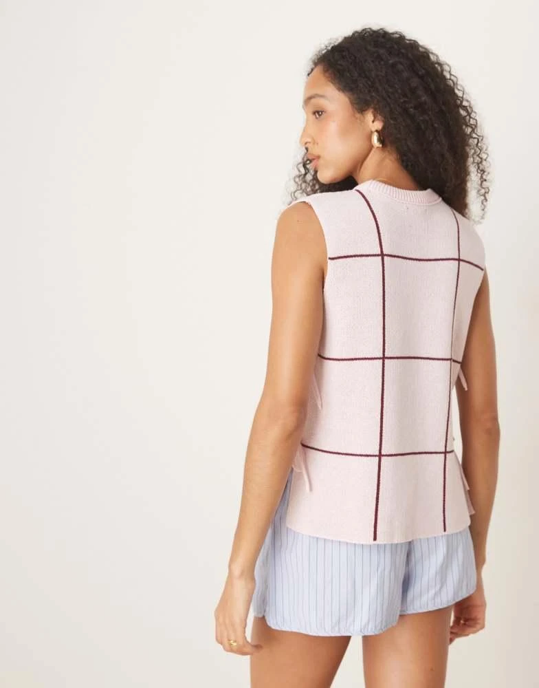 ASOS ASOS DESIGN crew neck knit tabard vest with floral embroidery in pink 4