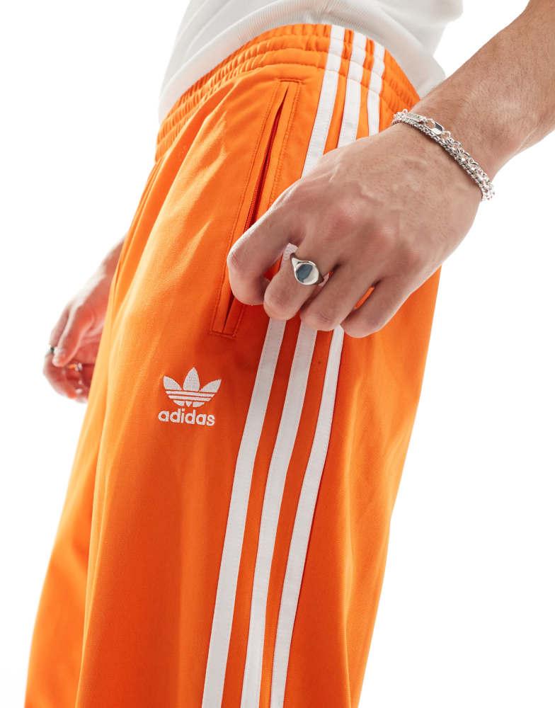 Adidas adidas Originals Firebird track pants in orange