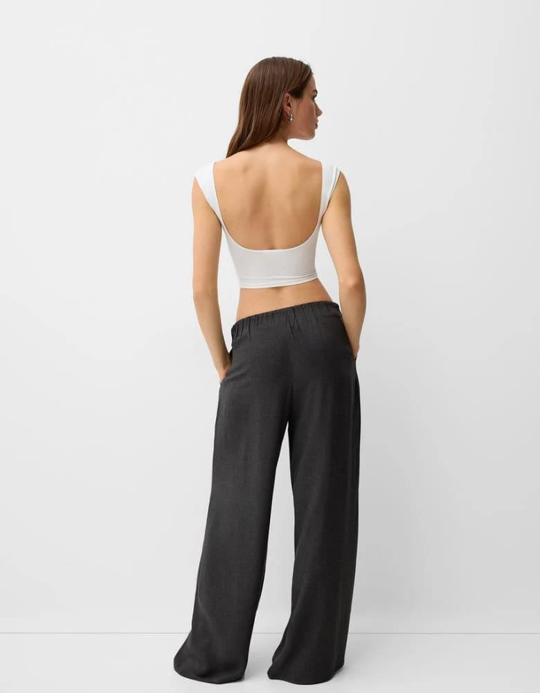 Bershka Bershka Petite drawstring waist wide leg trousers in dark grey check 4