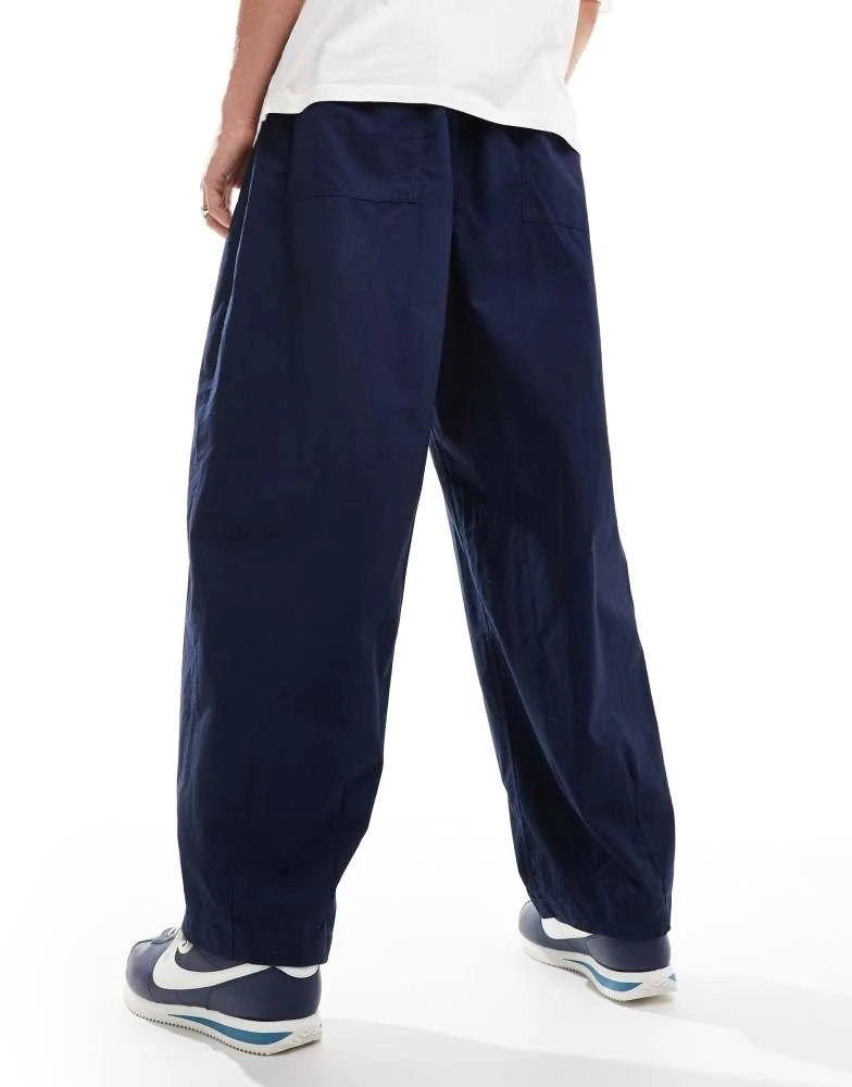 NIKE Nike Club woven balloon oversized trousers in navy 2