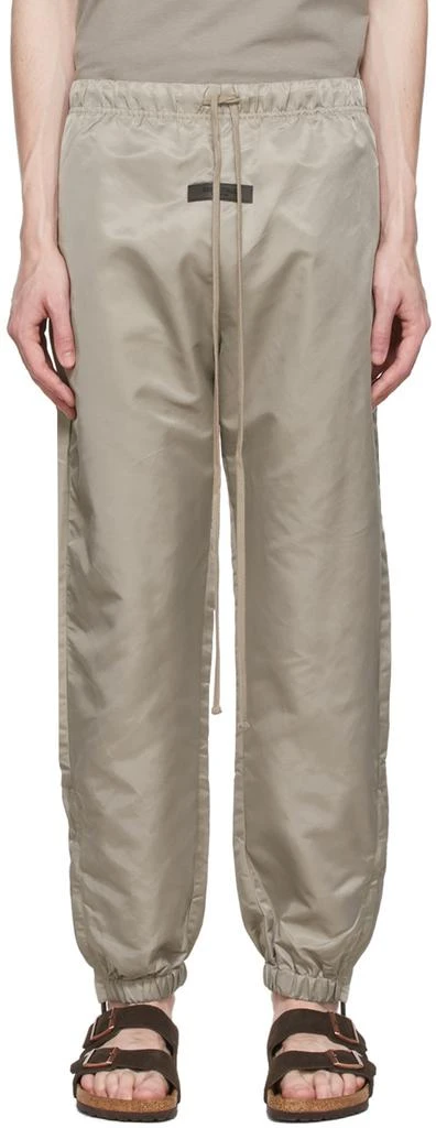 Fear of God ESSENTIALS Taupe Nylon Track Pants 1