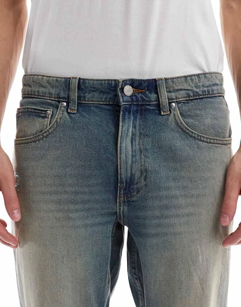 ASOS ASOS DESIGN tapered jeans with tint in light wash blue 4