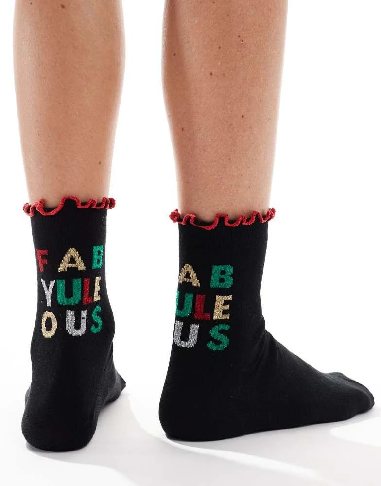 ASOS ASOS DESIGN Christmas slogan sock with frill edge in black 1