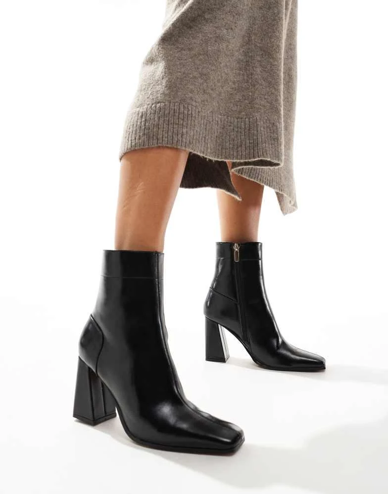 ASOS ASOS DESIGN Everest flared heel boots in black 1