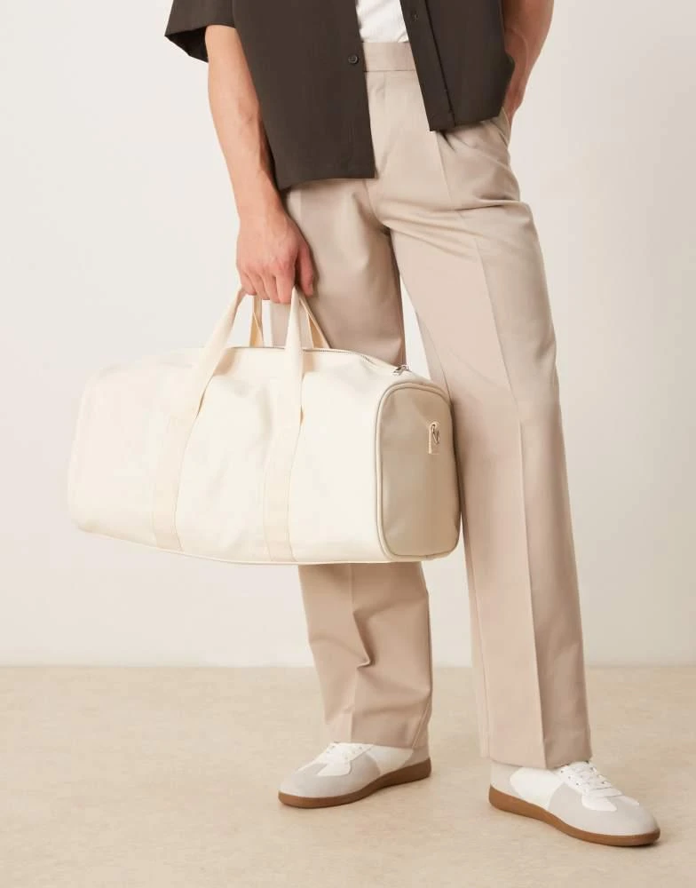 ASOS ASOS DESIGN canvas weekend duffel bag in ecru 1