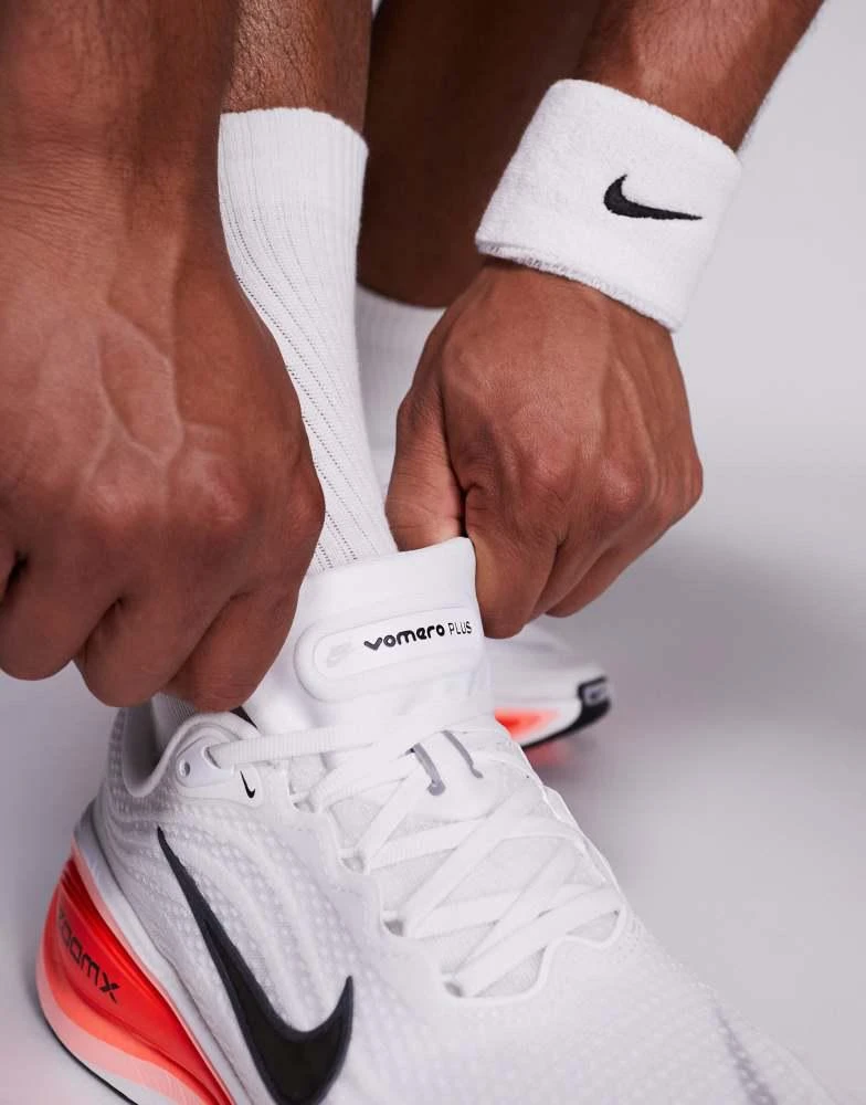 NIKE Nike Running Vomero Plus trainers in white and red 4