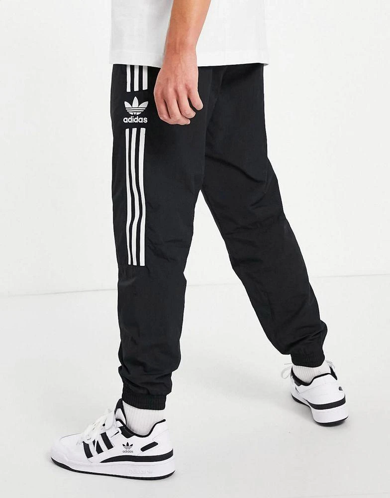 Adidas adidas Originals adicolor lock up joggers in black 3