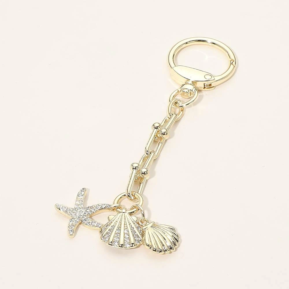 FASHNZFAB 14K Gold Plated CZ Stone Paved Starfish Sea Shell Charm Drop Bag Charm Keychain
