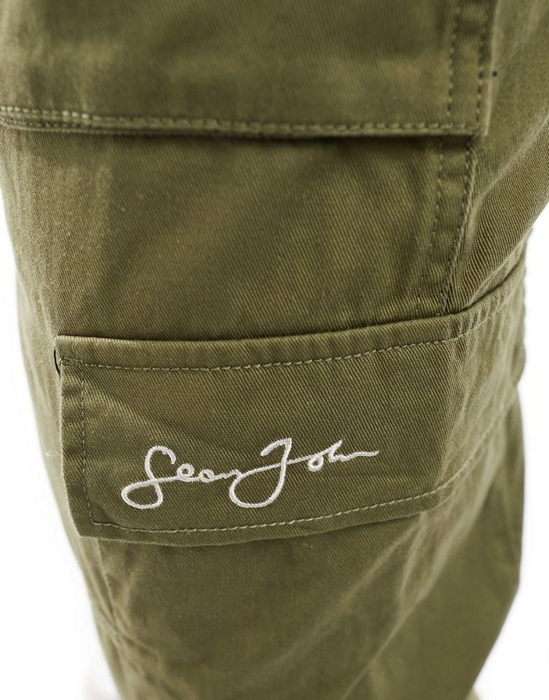 Sean John Sean John script logo wide leg cargo trousers in khaki with front hem split