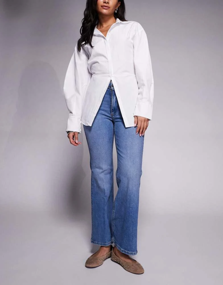 River Island River Island petite high rise pocket detail flare jeans in light denim 1