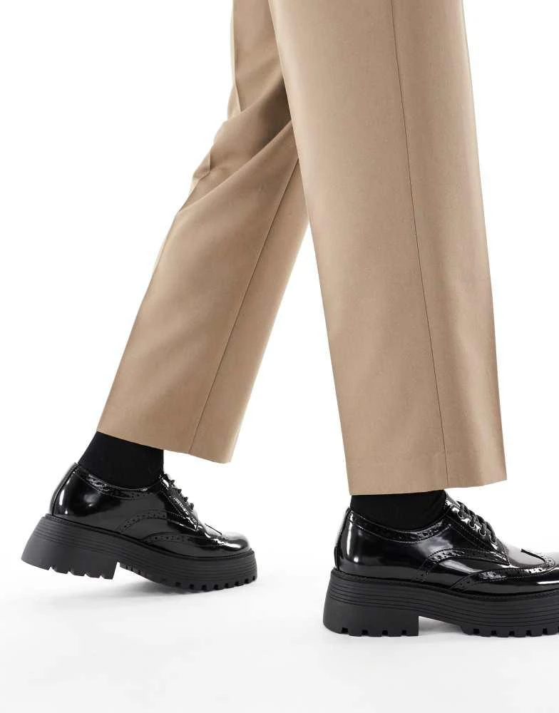 Shop ASOS DESIGN chunky lace up shoes in black with brogue 