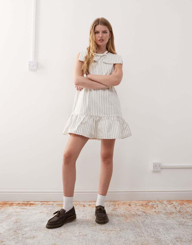 Reclaimed Vintage Reclaimed Vintage mini denim dress with sailor collar and frill hem in ecru pinstripe