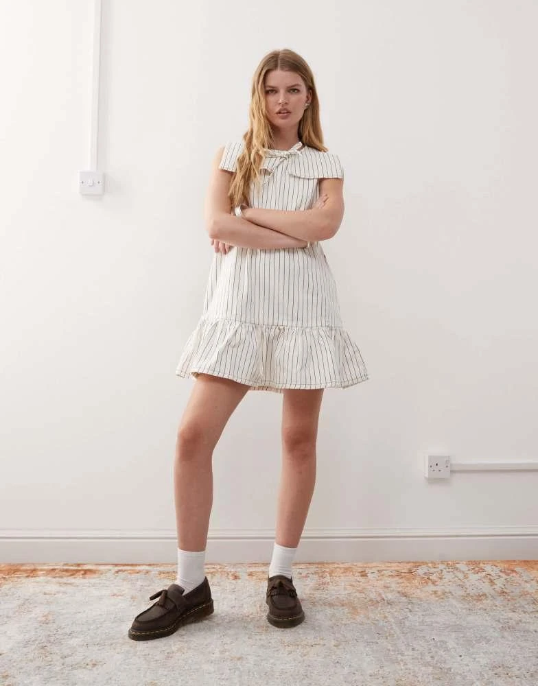 Reclaimed Vintage Reclaimed Vintage mini denim dress with sailor collar and frill hem in ecru pinstripe 1