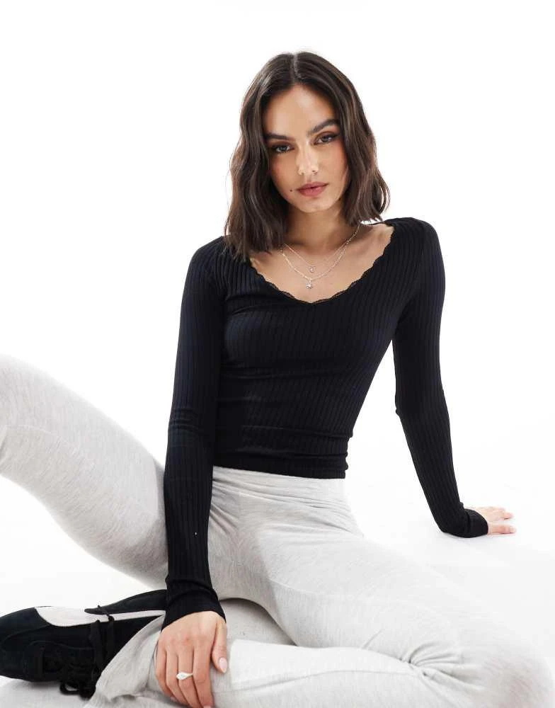 Stradivarius Stradivarius v neck long sleeve jersey top in black 1