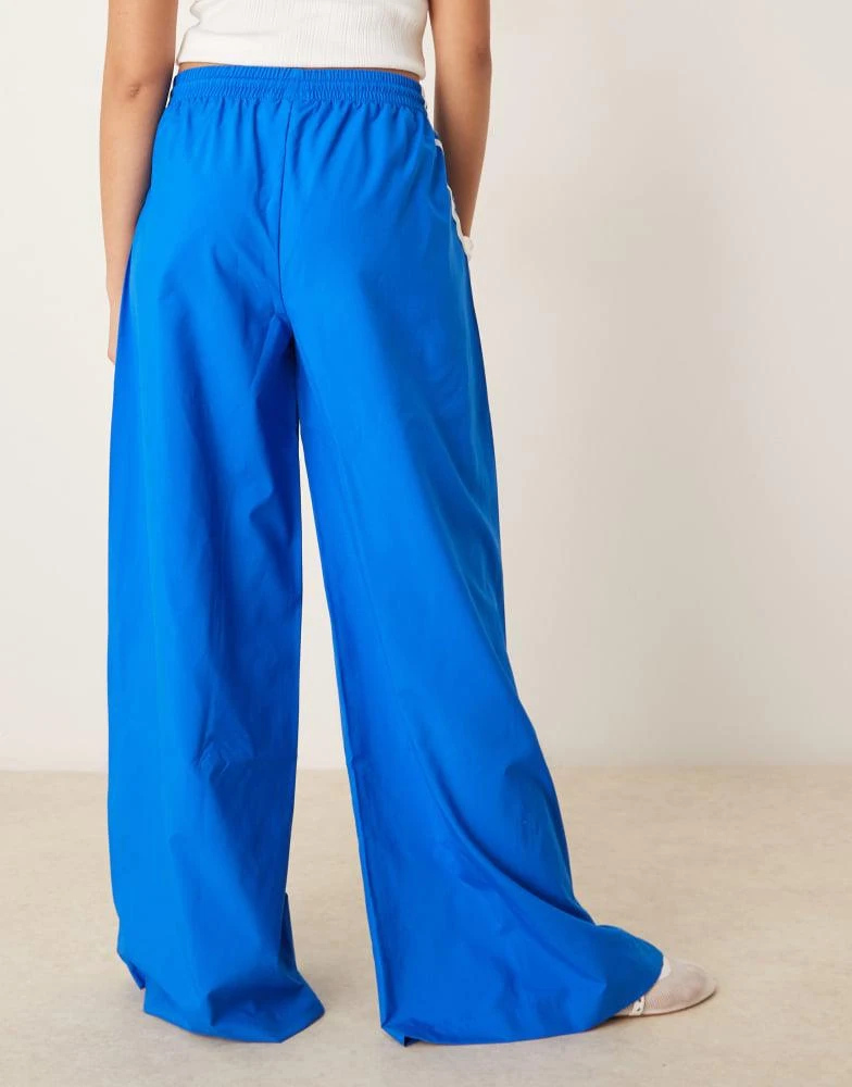 Adidas adidas Originals three stripe oversized track pants in blue 4