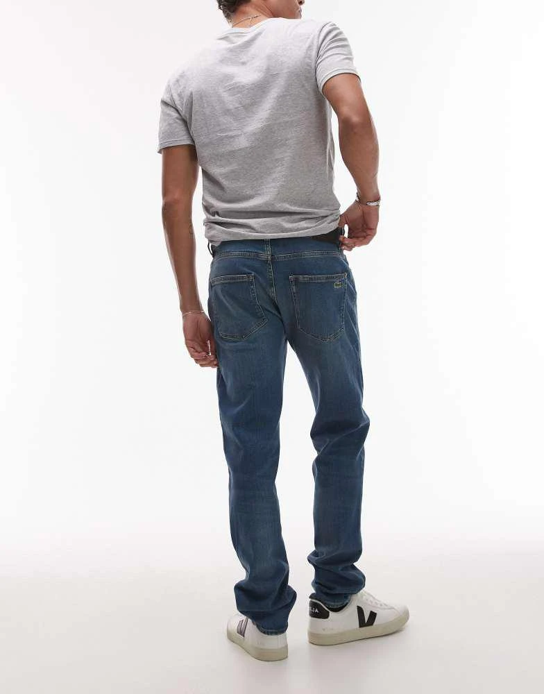 Lacoste Lacoste straight leg denim jeans in lightwash blue 4