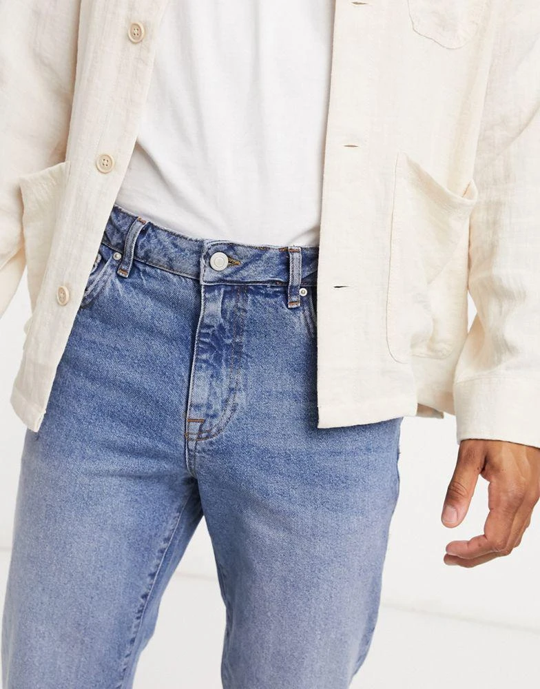 ASOS ASOS DESIGN classic rigid jeans in vintage light wash blue with raw hem 3