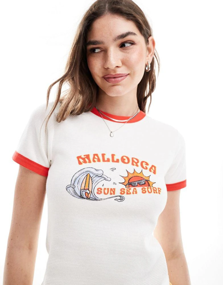 ASOS ASOS DESIGN waffle ringer baby tee with mallorca graphic in cream 1