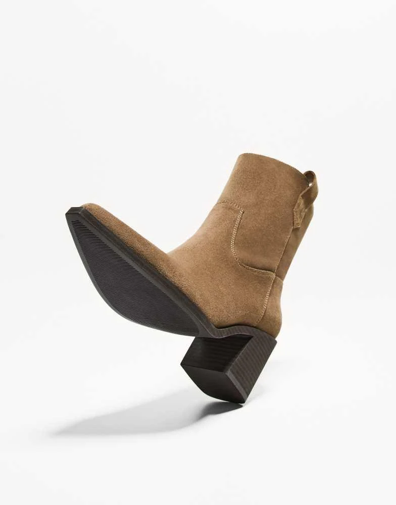 Bershka Bershka asymmetric heeled cowboy ankle boots in tan 4