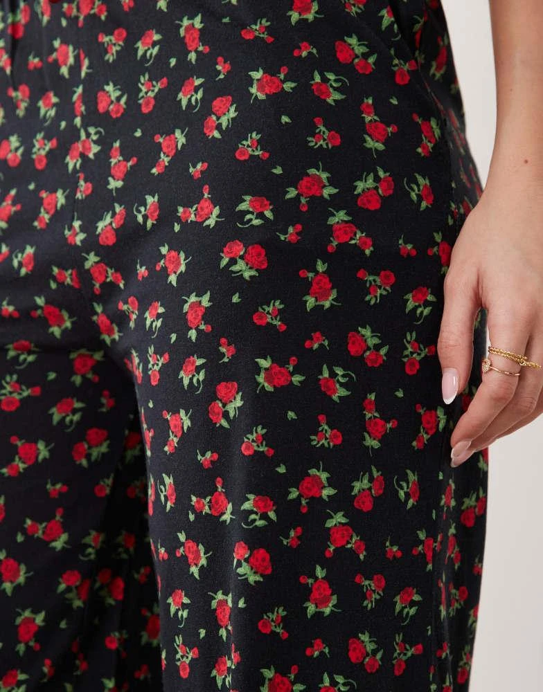 Threadbare Threadbare jersey pull on trouser with drawstring in black with red floral print 4