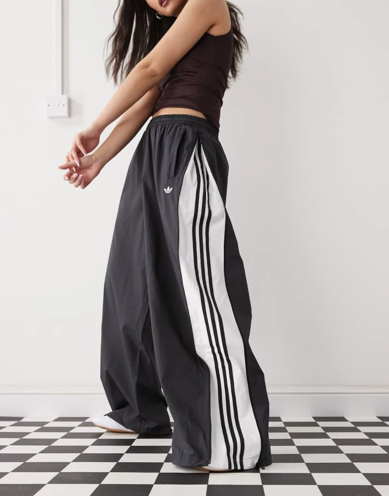 Adidas adidas Originals Adilenium Season 3 woven track pants in black 1