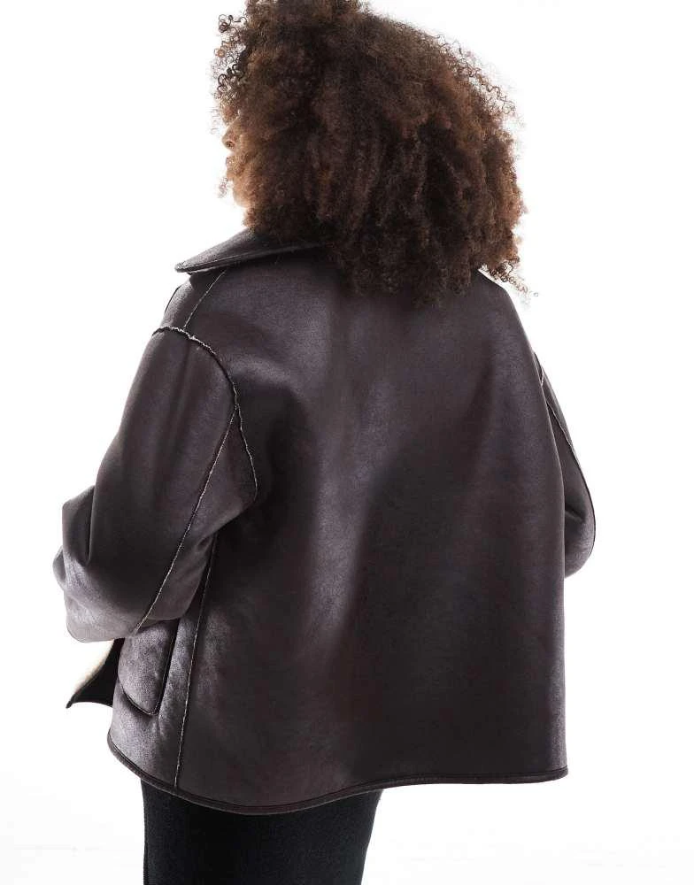 Stradivarius Stradivarius reversible borg jacket in ercu and brown 2