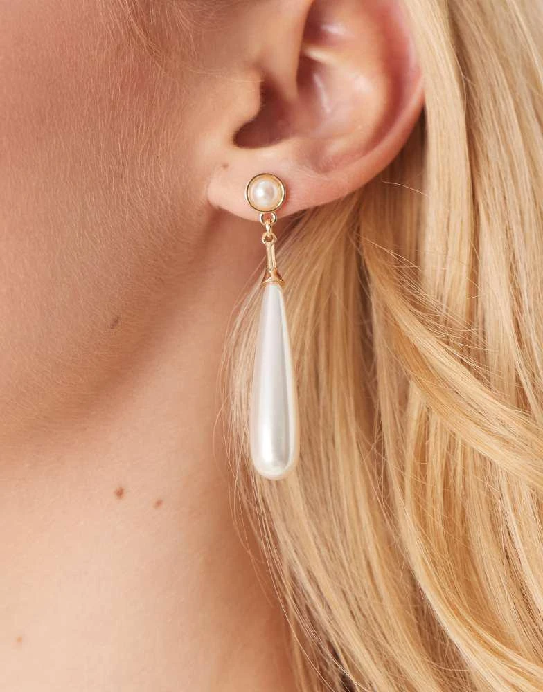 True Decadence True Decadence long pearl drop earrings in gold 2