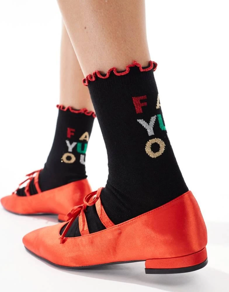 ASOS ASOS DESIGN Christmas slogan sock with frill edge in black 3