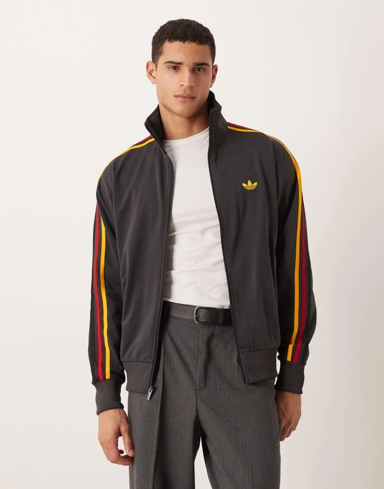 Adidas adidas Originals Firebird track top in black and gold