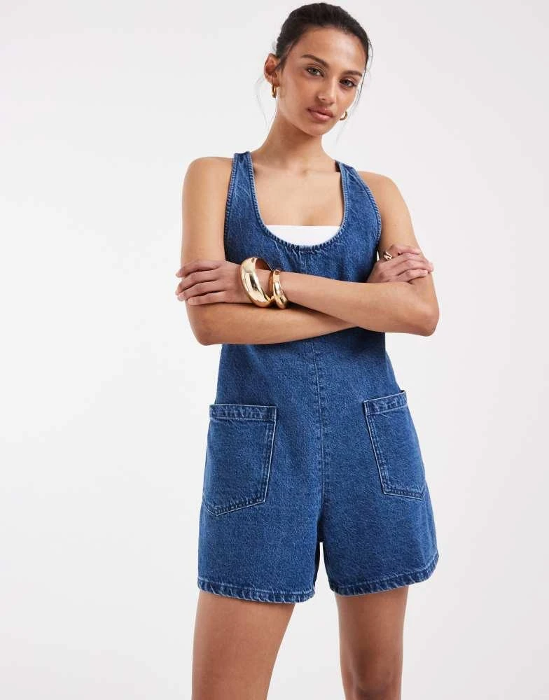 ASOS ASOS DESIGN denim playsuit with scoop neck and cross back in dark mid blue