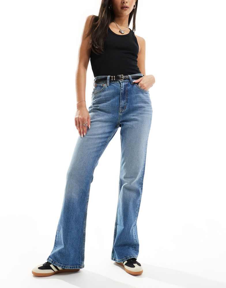 ASOS ASOS DESIGN mid rise flare jeans in mid blue