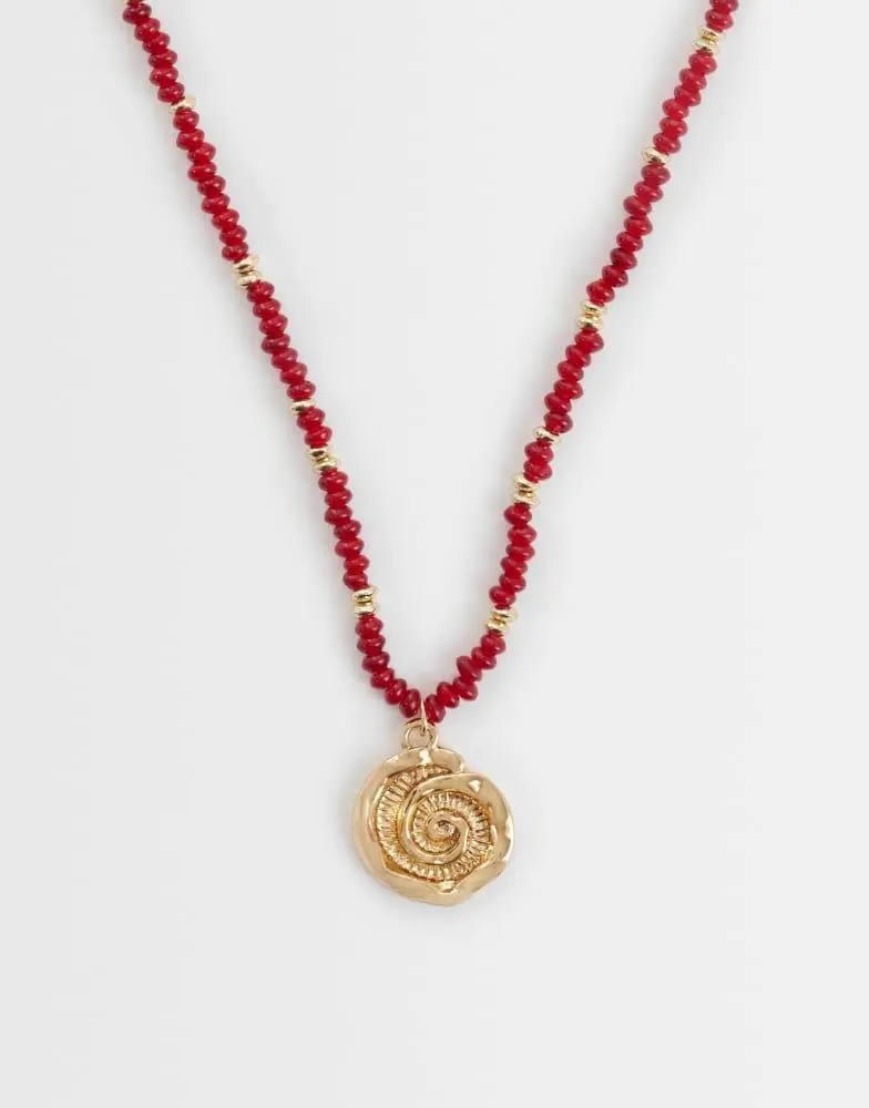 ASOS ASOS DESIGN necklace with burgundy beads and shell pendant in gold tone
