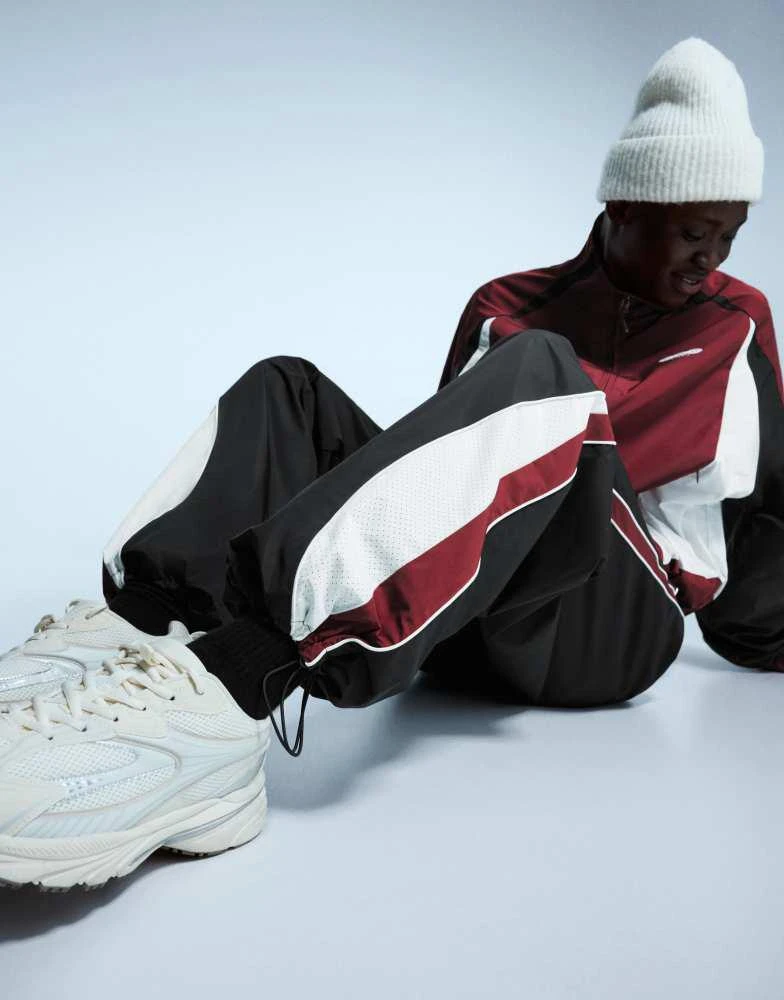 Bershka Bershka Super baggy technical sports trousers in black 3