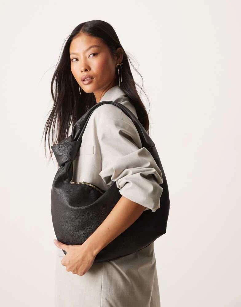 Shop New Look knotted strap shoulder bag in black on Sale at