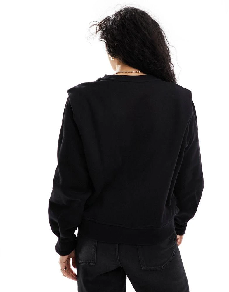 & Other Stories & Other Stories sweatshirt with bold shoulder and pleated cuffs  in black 4