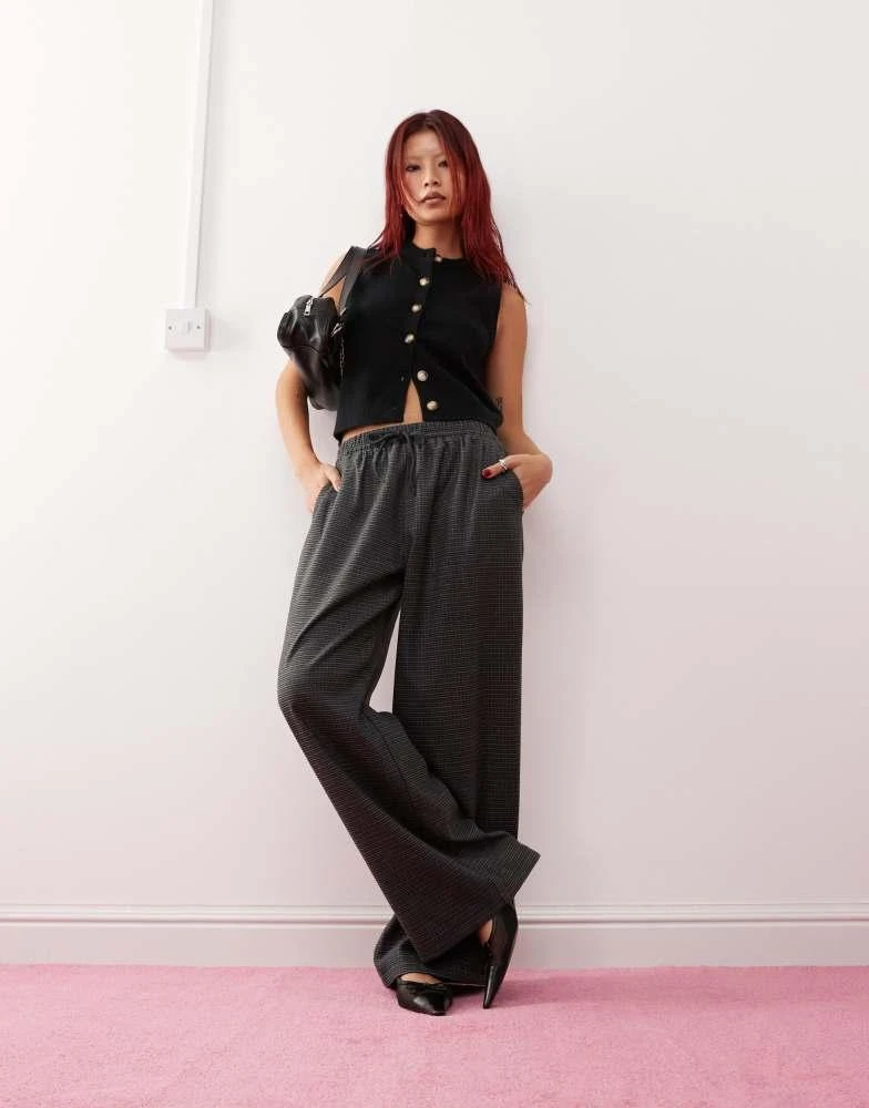 Motel Motel sasari oversized check trousers in navy 1
