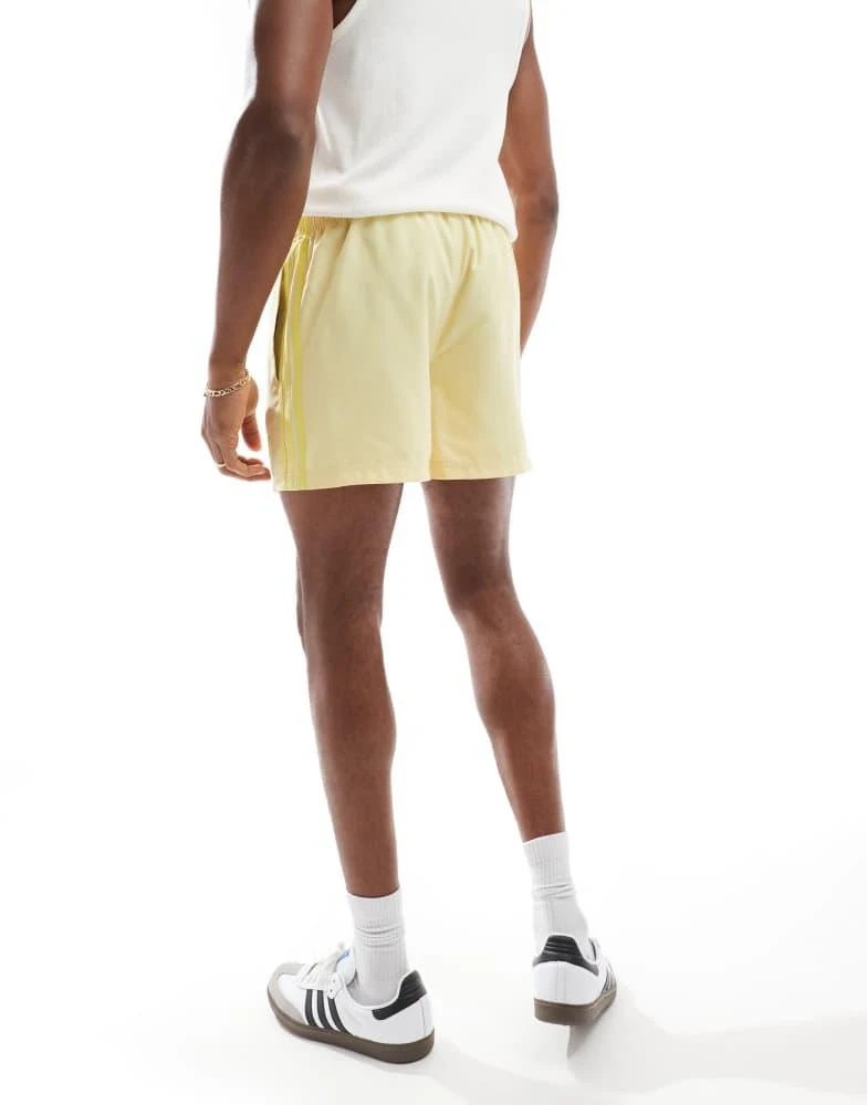 Adidas adidas Originals Adicolor 3-Stripes 5-Inch Swim Shorts in yellow 3