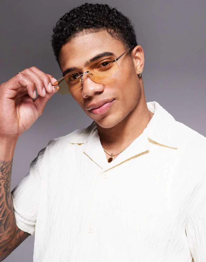ASOS ASOS DESIGN rectangle rimless sunglasses with yellow lens and gold temples 1