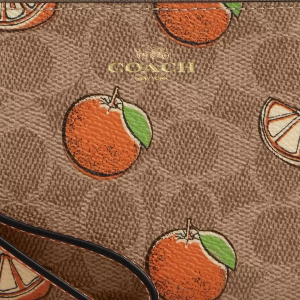 Coach Corner Zip Wristlet In Signature Canvas With Orange Print 4