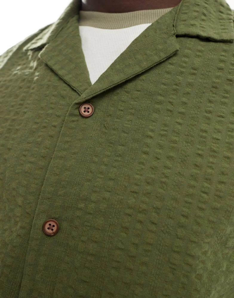 ASOS ASOS DESIGN 90s oversized short sleeve shirt in seersucker texture in khaki green 3