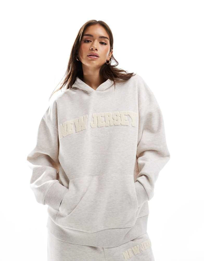 ASOS ASOS DESIGN oversized hoodie co-ord with chenille New Jersey graphic in oatmeal marl 1
