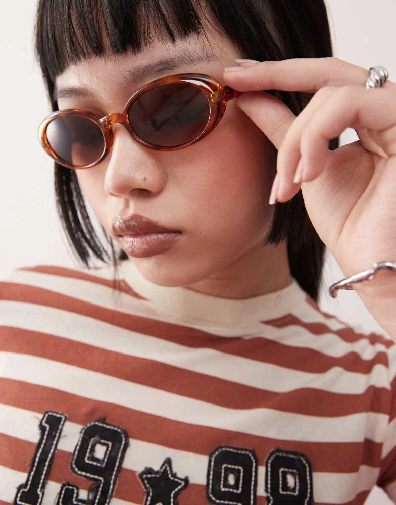 Shop Reclaimed Vintage oval sunglasses in orange  display picture 2