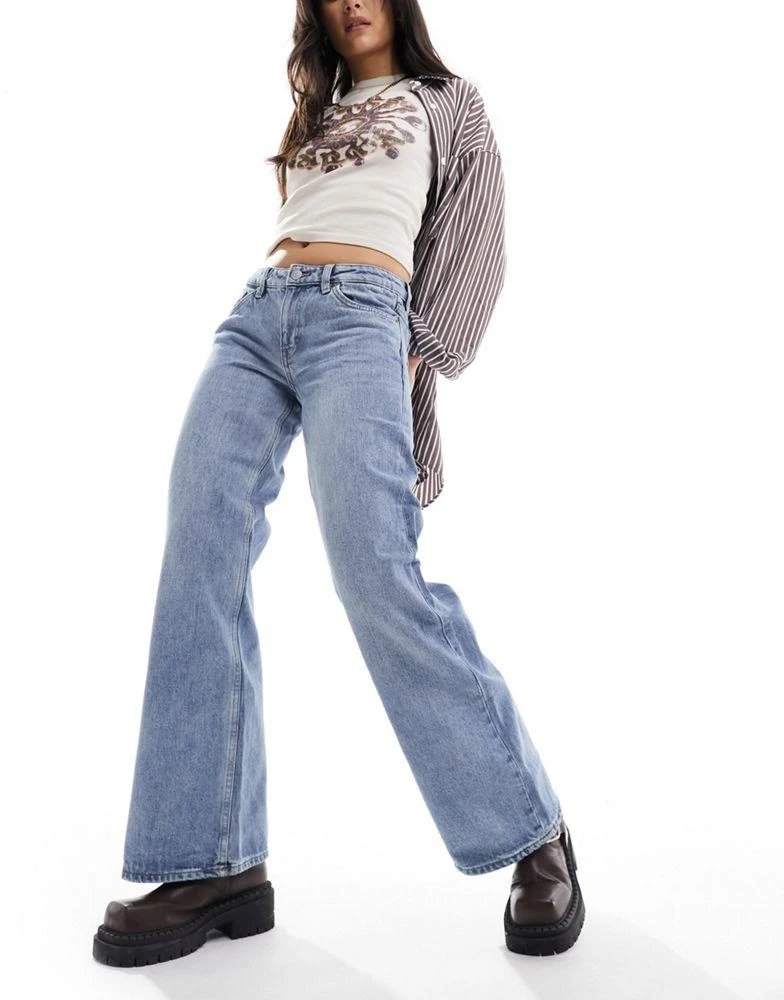Monki Monki Imoo low waisted wide fit jeans in mid blue wash 1