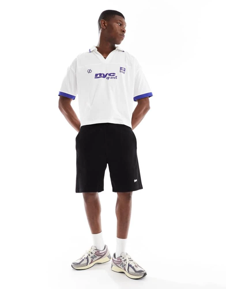 ASOS ASOS DESIGN boxy oversized polo with cut and sew and sports graphics in white 2