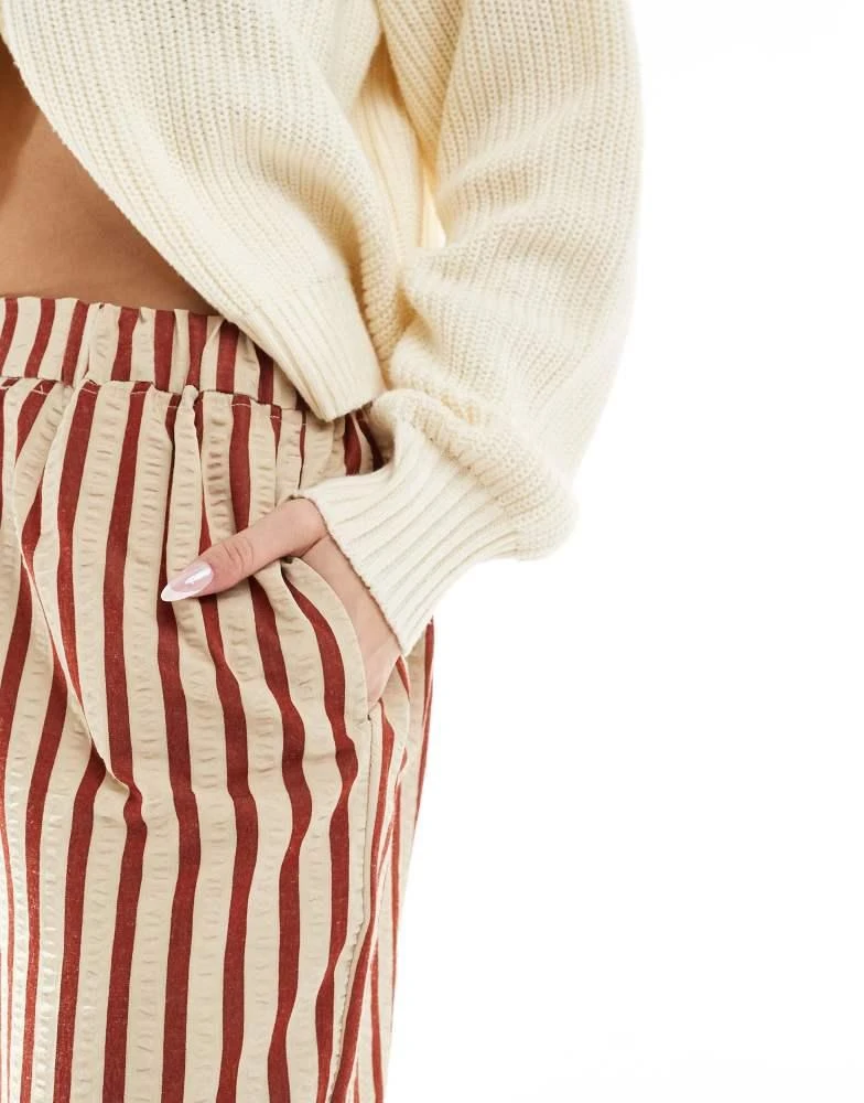 ASOS ASOS DESIGN straight leg seersucker trousers in rust stripe 3