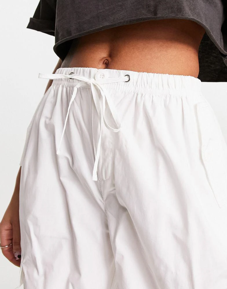 Bershka Bershka tie waist nylon cargo parachute trousers in white 2