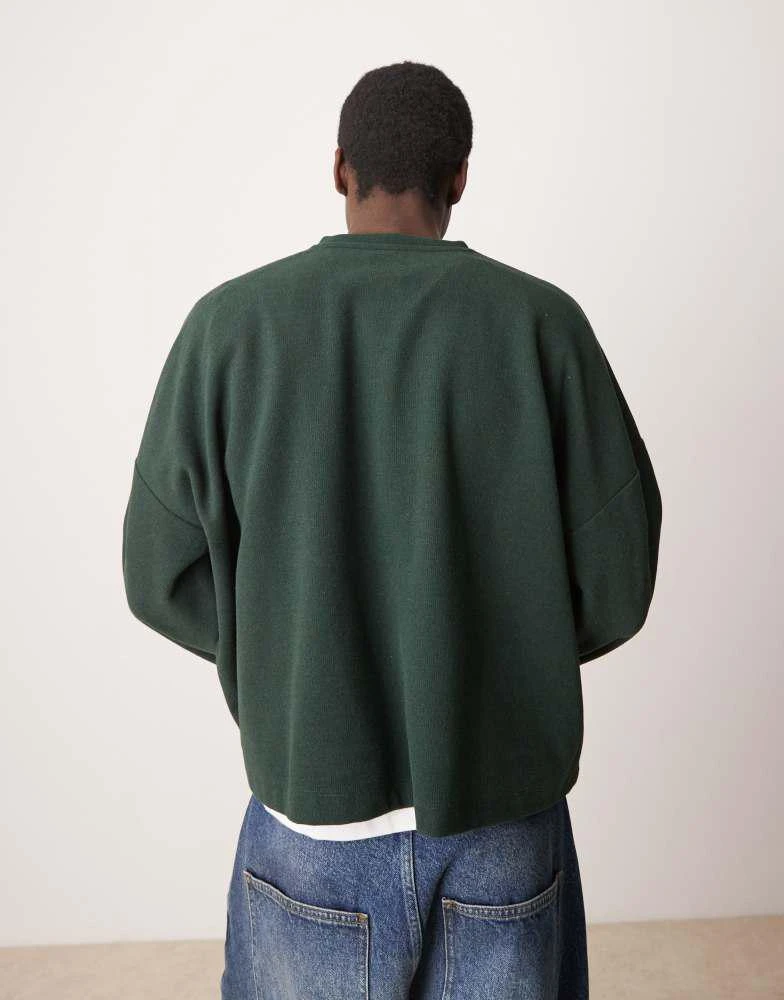 ASOS ASOS DESIGN super oversized cropped heavyweight rib henley jumper in dark green 4