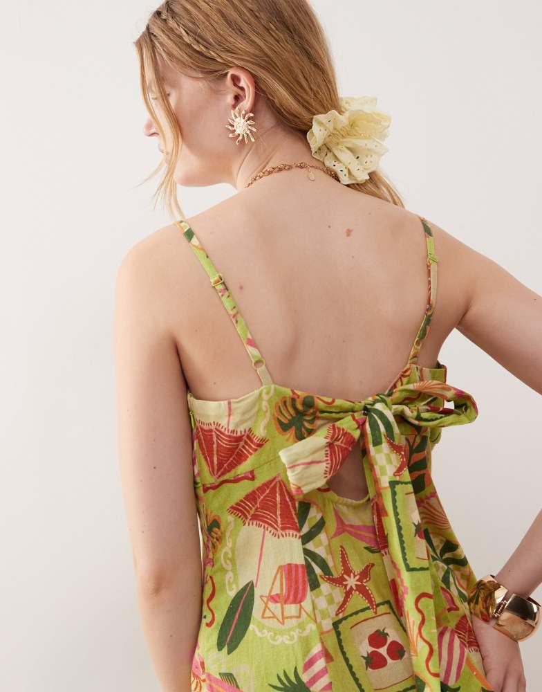 Reclaimed Vintage Reclaimed Vintage midi dress with bust cup detail and godets in holiday postcard print